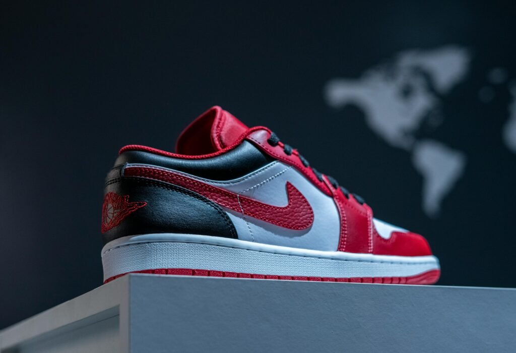 Close-up of a red and white Air Jordan sneaker with a sleek design, ideal for fashion photography.